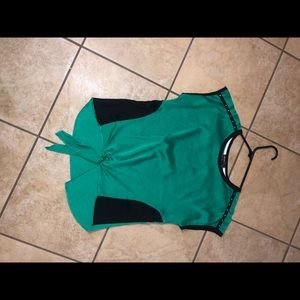 A green and black children’s shirt